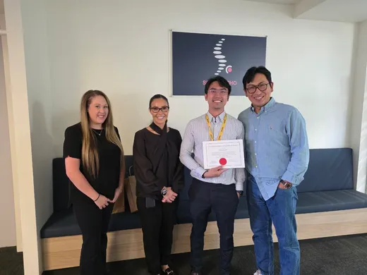 Fellowship certificate presentation with the clinic team