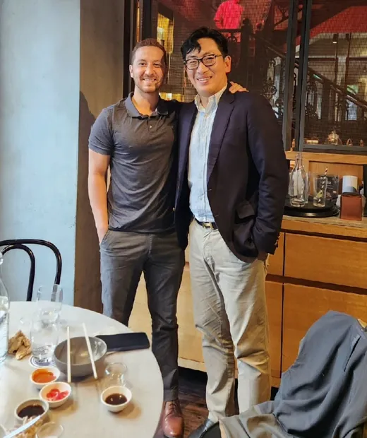 Two fellows at a farewell dinner at a restaurant