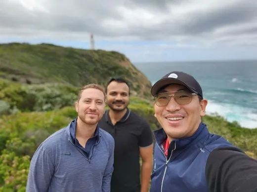 Coastal walk with a lighthouse in the background