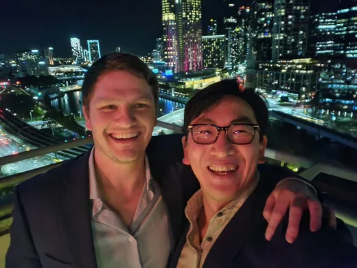 Rooftop night selfie against the Melbourne skyline